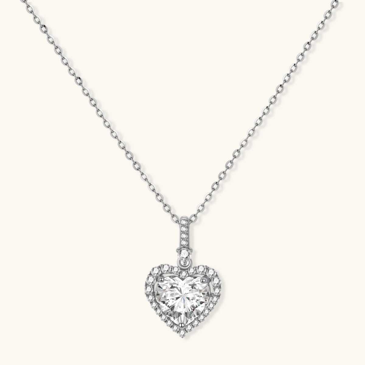 Complete jewelry set with heart-shaped sterling silver pieces featuring brilliant moissanite stones .